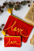 Velvet Love pattern pouch with stitched detail and tassel on zip