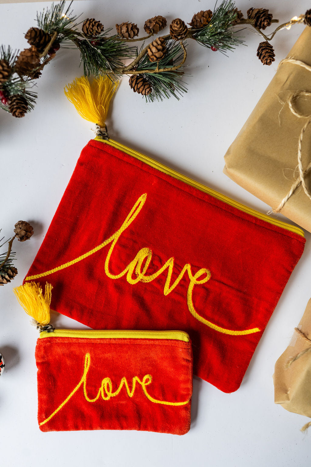 Velvet Love pattern pouch with stitched detail and tassel on zip