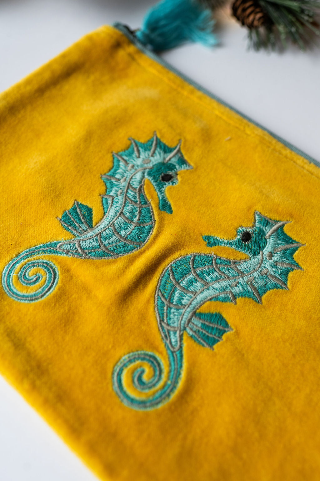 Velvet Seahorse pattern pouch with stitched detail and tassel on zip