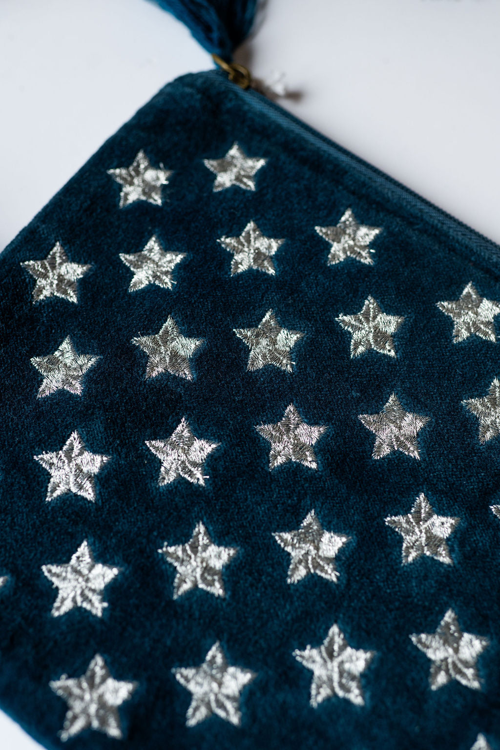 Velvet Star pattern pouch with stitched detail and tassel on zip