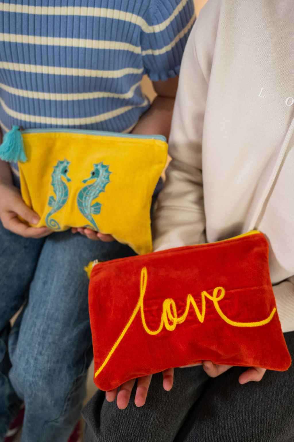 Velvet Love pattern pouch with stitched detail and tassel on zip