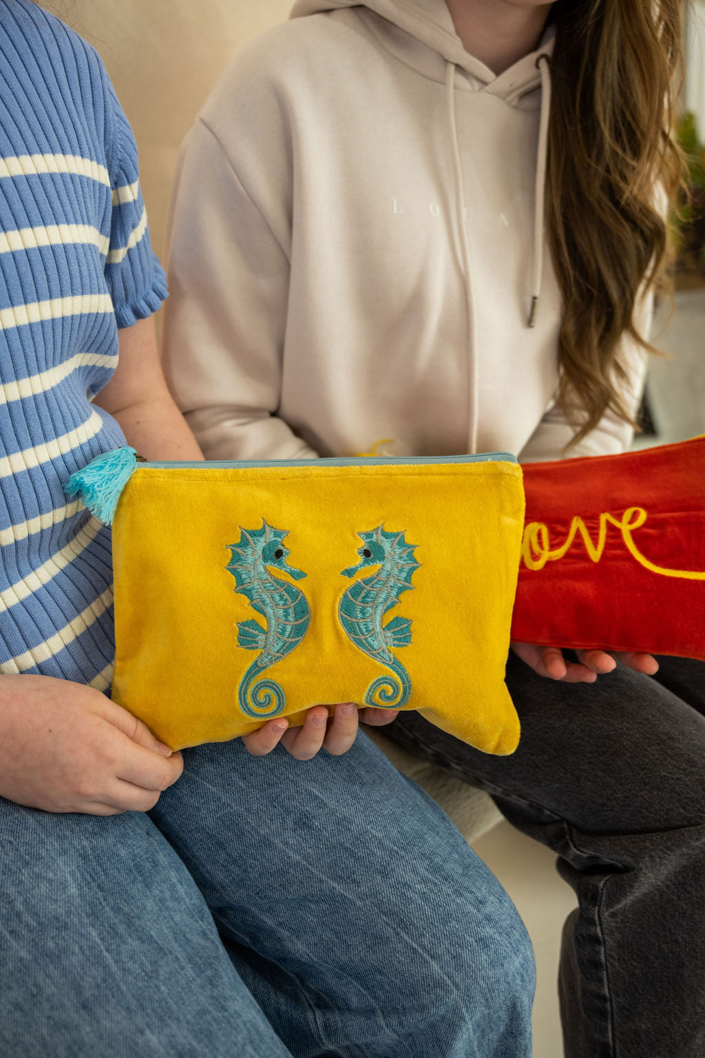 Velvet Seahorse pattern pouch with stitched detail and tassel on zip