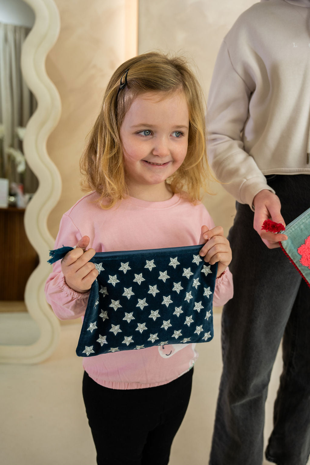 Velvet Star pattern pouch with stitched detail and tassel on zip