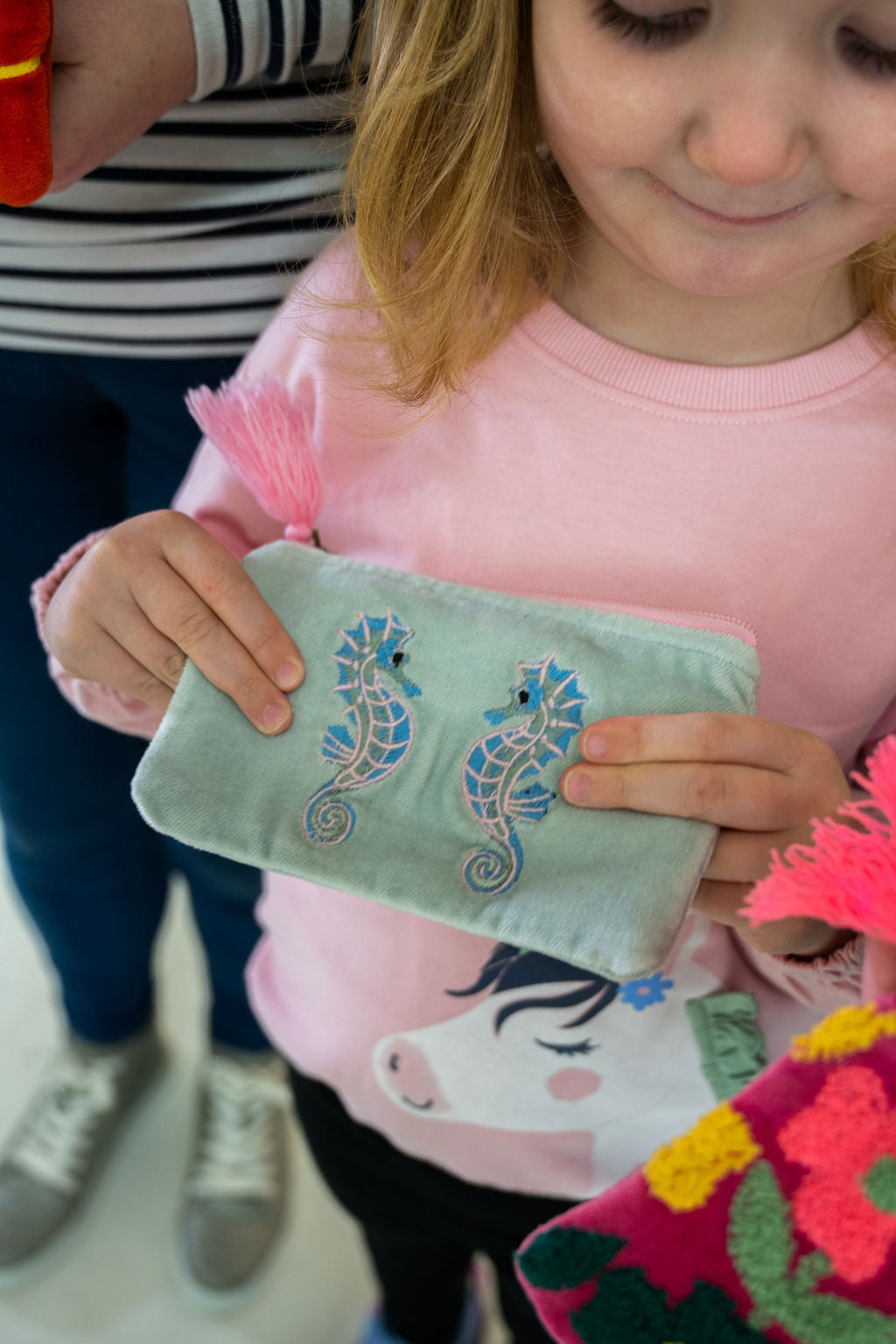 Velvet Seahorse pattern pouch with stitched detail and tassel on zip
